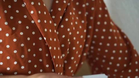 Close-up mid section of woman making marijuana joint Stock-Footage 120068844