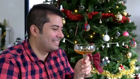 Close up of a middle age man saying happy new year and raising a toast Stock Footage 140756090