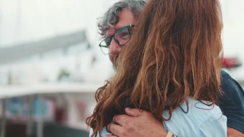 Close up, middle-aged couple in love hugging each other standing on the Stock Footage 254914742