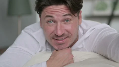 Close up Middle Aged Man doing Video Chat, in Bed Video stock 142379503