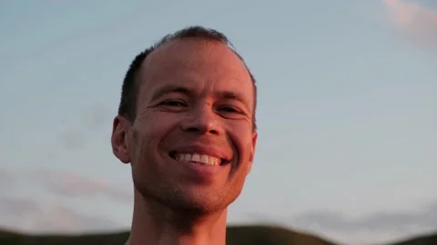 Close-up of a middle-aged man looking and smiling at the camera 库存影片 229236033