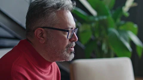 Close Up of Middle-Aged Man Talking Openly during Therapy Session Stock Footage 317733352