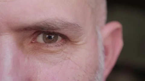 Close-up of middle-aged man's eye showing deep reflection Stock Footage 278166847