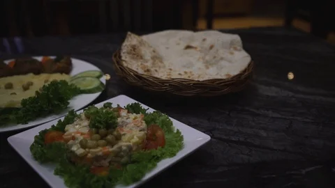 Close-up of middle eastern dishes served on a table Stock Footage 129928094