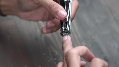 Close Up of Middle Finger Nail Clippers Stock Footage 279037316