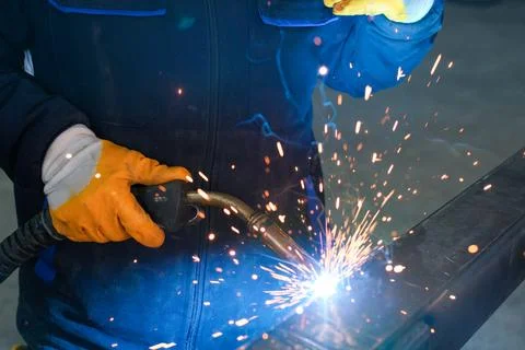 Close-up of MIG Welding Process on Metal with Sparks Flying Stock Photos