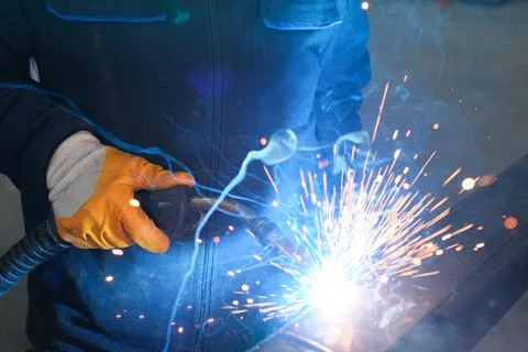 Close-up of MIG Welding Process on Metal with Sparks Flying Stock Photos