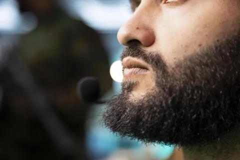 Close up of military operator communicating through headset microphone Stock Photos