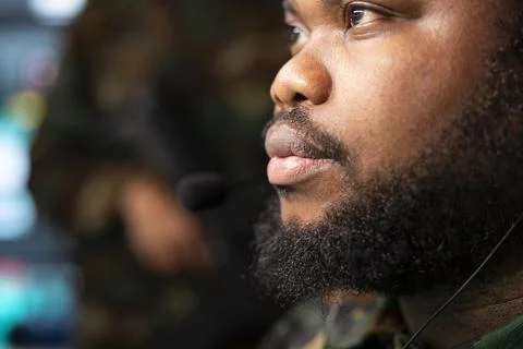 Close up of military operator using audio headset to listen and communicate Stock Photos