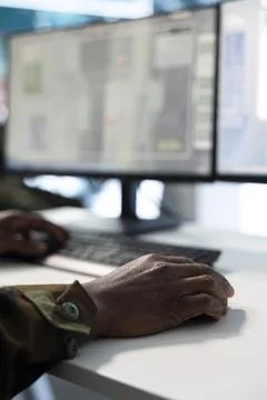 Close up of military operator using computer to target enemy rockets Stock Photos