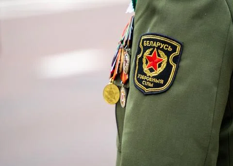 Close up of military shoulder patch and gold medals Stock Photos