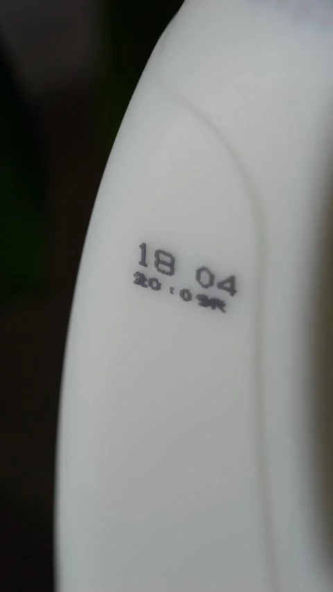 Close-up of milk bottle with expiration date, highlighting food safety and shelf Video stock 332903741