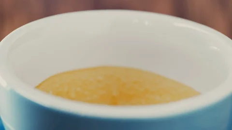 Close-Up of Milk Pouring into Espresso to Create Latte Stock Footage 129304204