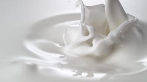 Close-up milky liquid being poured. Slow Motion. Stock Footage
