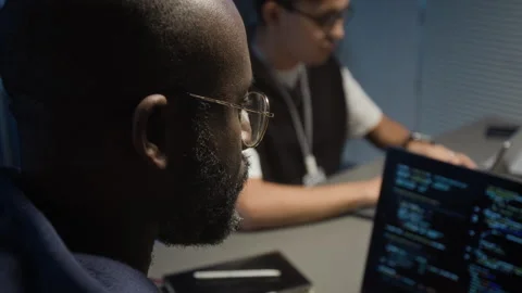 Close-up of Millennial Male Developer Coding on Laptop in IT Office at Night Video stock 329616911