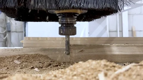 Close-up of the milling process of MDF, particleboard, and plywood on a CNC Stock Footage 276329661