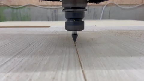 Close-up of the milling process of MDF, particleboard, and plywood on a CNC Stock Footage 276329706