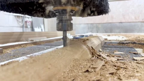 Close-up of the milling process of MDF, particleboard, and plywood on a CNC Stock Footage 276565409