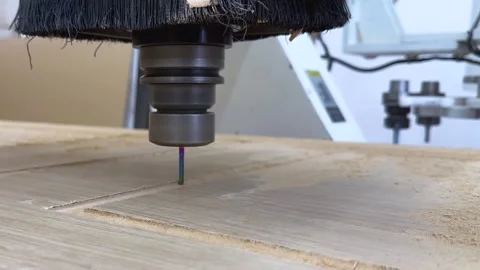 Close-up of the milling process of MDF, particleboard, and plywood on a CNC Stock Footage 276624414