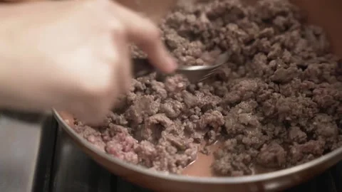 Close-up of minced meat being cooked in a pan. Home cooking, stuffing for Видео 345102339