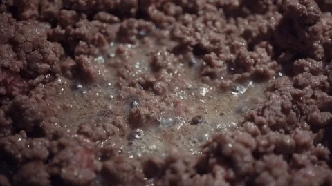 Close-up of minced meat sizzling in the pan Stock Footage 119332339
