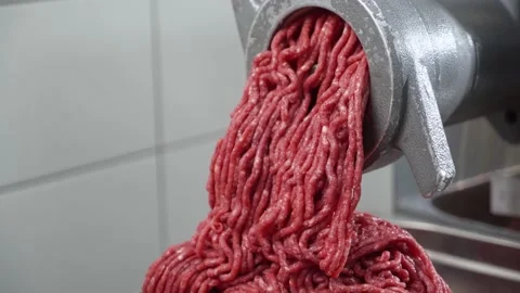 Close-up of minced meat. The work of the meat grinder. Stock Footage 239400281