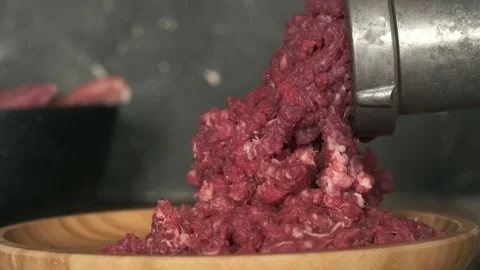 Close up of mincing beef meat with old manual meat grinder Stock Footage 250194818