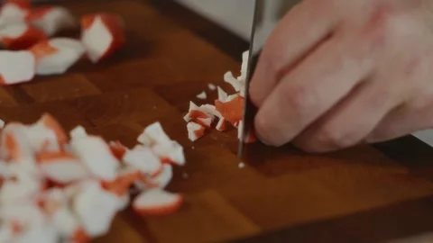 Close-up of mindful crab stick slicing Stock Footage 317553631