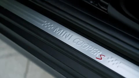 Close up of Mini Cooper S interior design with focus on logo detail on door Stock Footage 261247569
