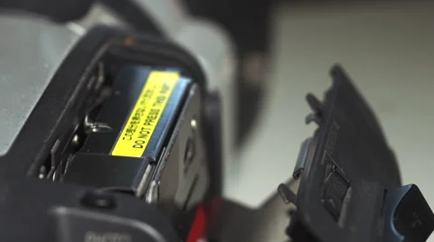 Close up of a mini DV camera deck showing tape insertion and removal. Stock Footage 62530158