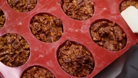 Close-up of Mini Pecan Pie Tarts in Red Silicone Baking Mold Stock Footage 337751610