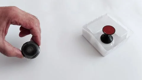 Up Close: Mini Video Camera in Hand - Features Size Stock Footage 313184748