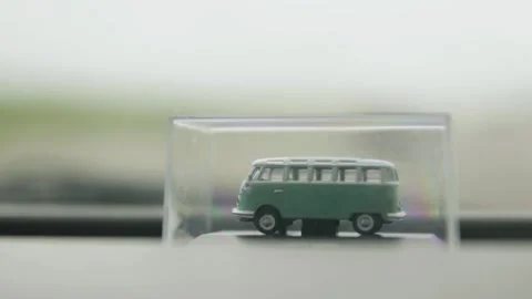 Close up of Miniature Model of Volkswagen Bus on Roadtrip, Slow Motion Stock Footage