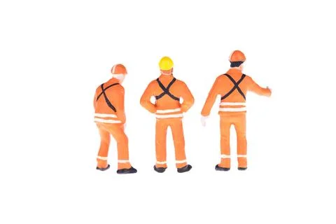 Close up of Miniature people in engineer and worker occupation isolate on w.. Stock Illustration
