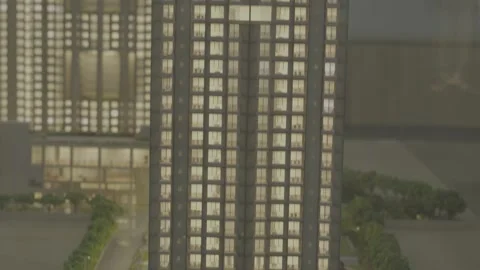 Close-up of a miniature skyscraper model with illuminated windows. Stock-Footage 330239173