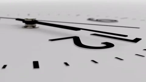 Close-up minimalist black wall clock on white background, dolly camera movement Stock Footage 306545330