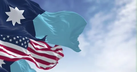 Close-up of Minnesota new state flags waving with the american flag on a cl.. Stock Footage 297393700