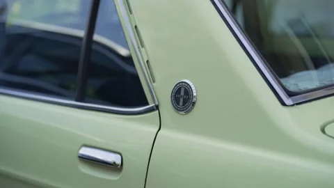 Close up of mint green classic car door with chrome details Stock Footage 314001308
