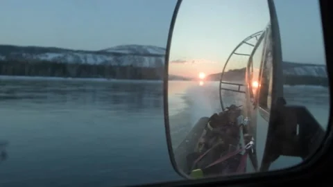 Close-up mirror of a hovercraft traveling on a river in winter Stock Footage 180609665