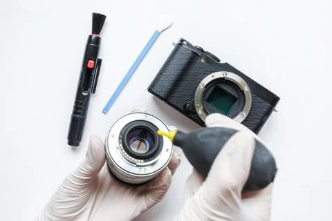 Close-up of mirrorless digital APS-C dirty camera matrix sensor cleaning Stock Photos