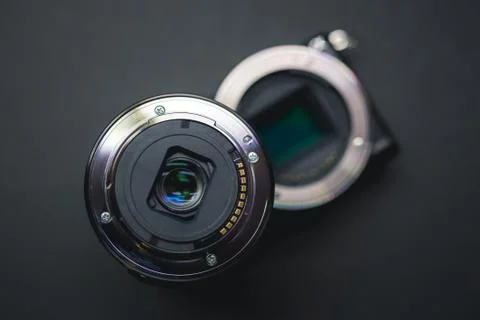 Close-up of mirrorless digital APS-C camera with deattached lens. Stock Photos