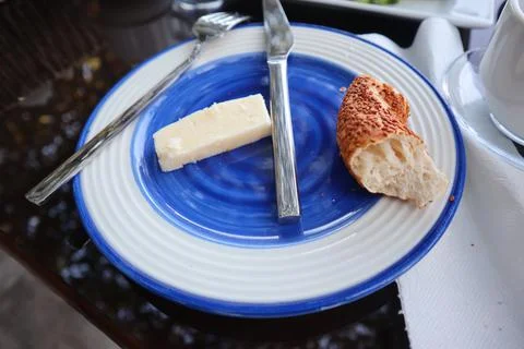 Close-up of missing bite on a bread with mayonaise on the fork on the morning Stock Photos
