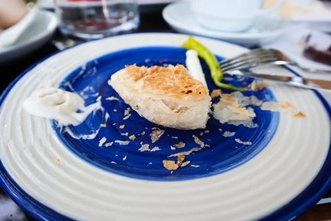 Close-up of missing bite on a bread with mayonaise on the fork on the morning Stock Photos