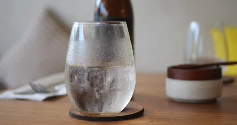 A close-up of a misted clear glass on a cafe table. 库存影片 279732173