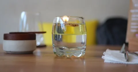 A close-up of a misted clear glass on a cafe table. Stockbeeldmateriaal 279734375