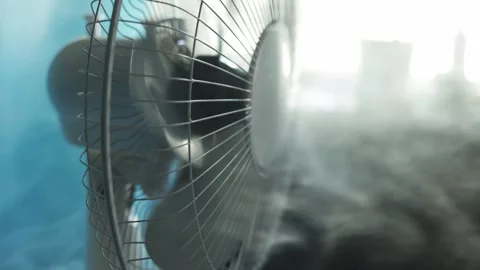 Close-up of a misting fan creating a cool refreshing spray on a bright day Stock Footage 340266897