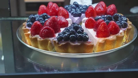 Close-Up of Mixed Berry Tart with Fresh Strawberries and Blueberries Stock Footage 337751218