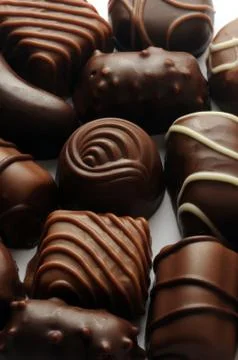 Close up on mixed chocolates. Stock Photos