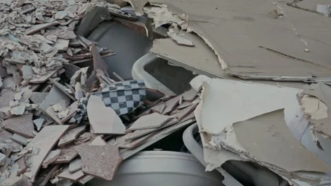 Close-up of Mixed Construction Waste Including Tiles Wood and Gypsum Board Stock Footage 326576918