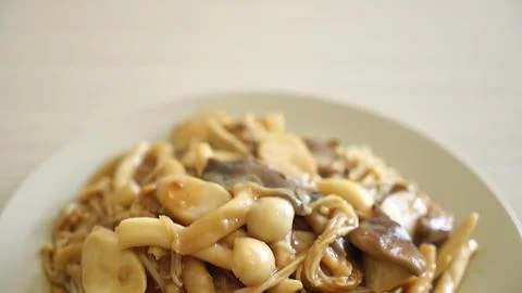 Close-up of mixed mushroom dish on a white plate Stock-Fotos